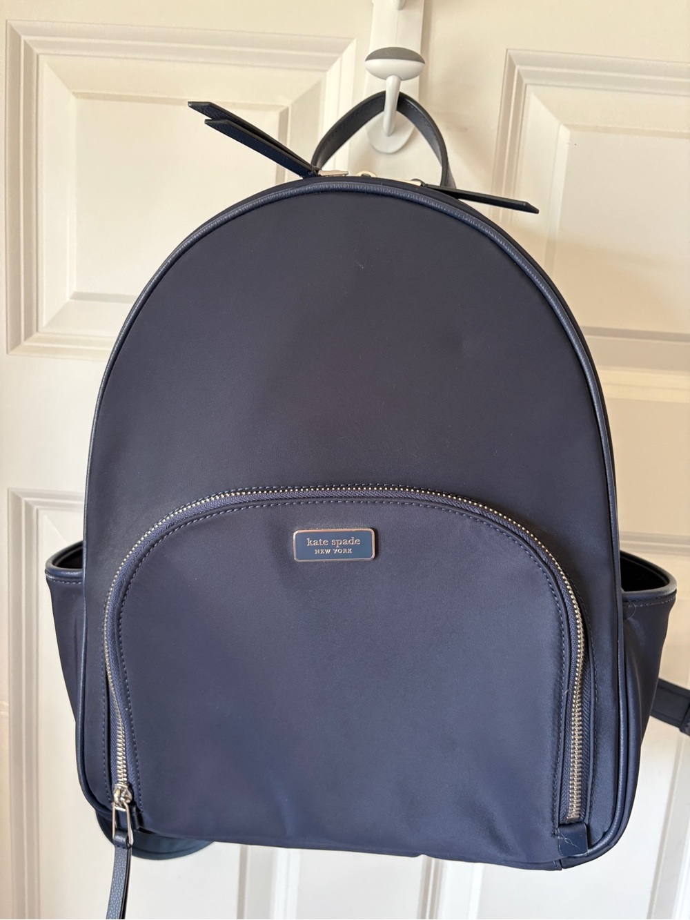 kate spade navy backpack with front zip pocket